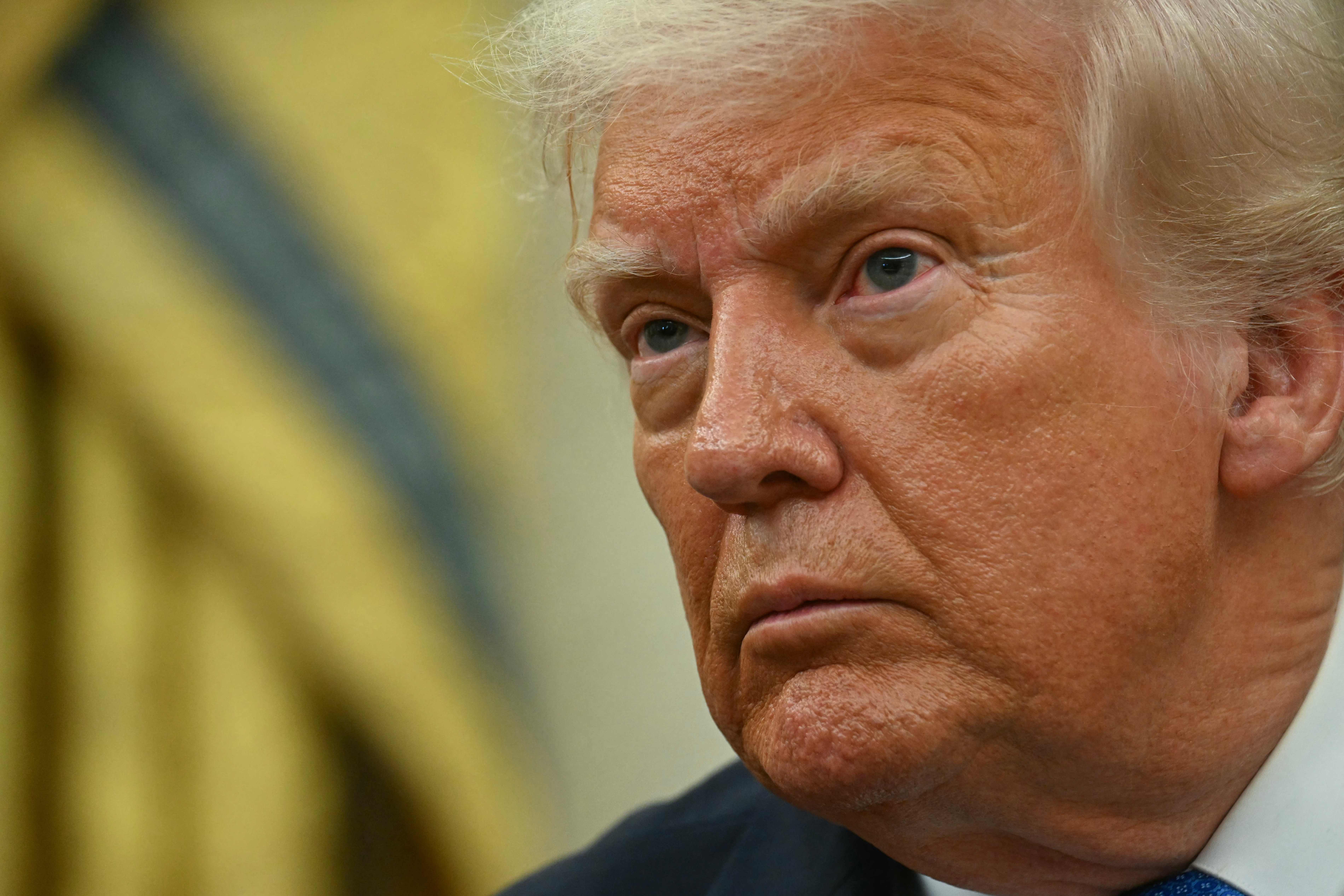 US President Donald Trump speaks as he honors fallen law enforcement officers, in the Oval Office of the White House on May 19, 2025, in Washington, DC. (Photo by Jim WATSON / AFP)