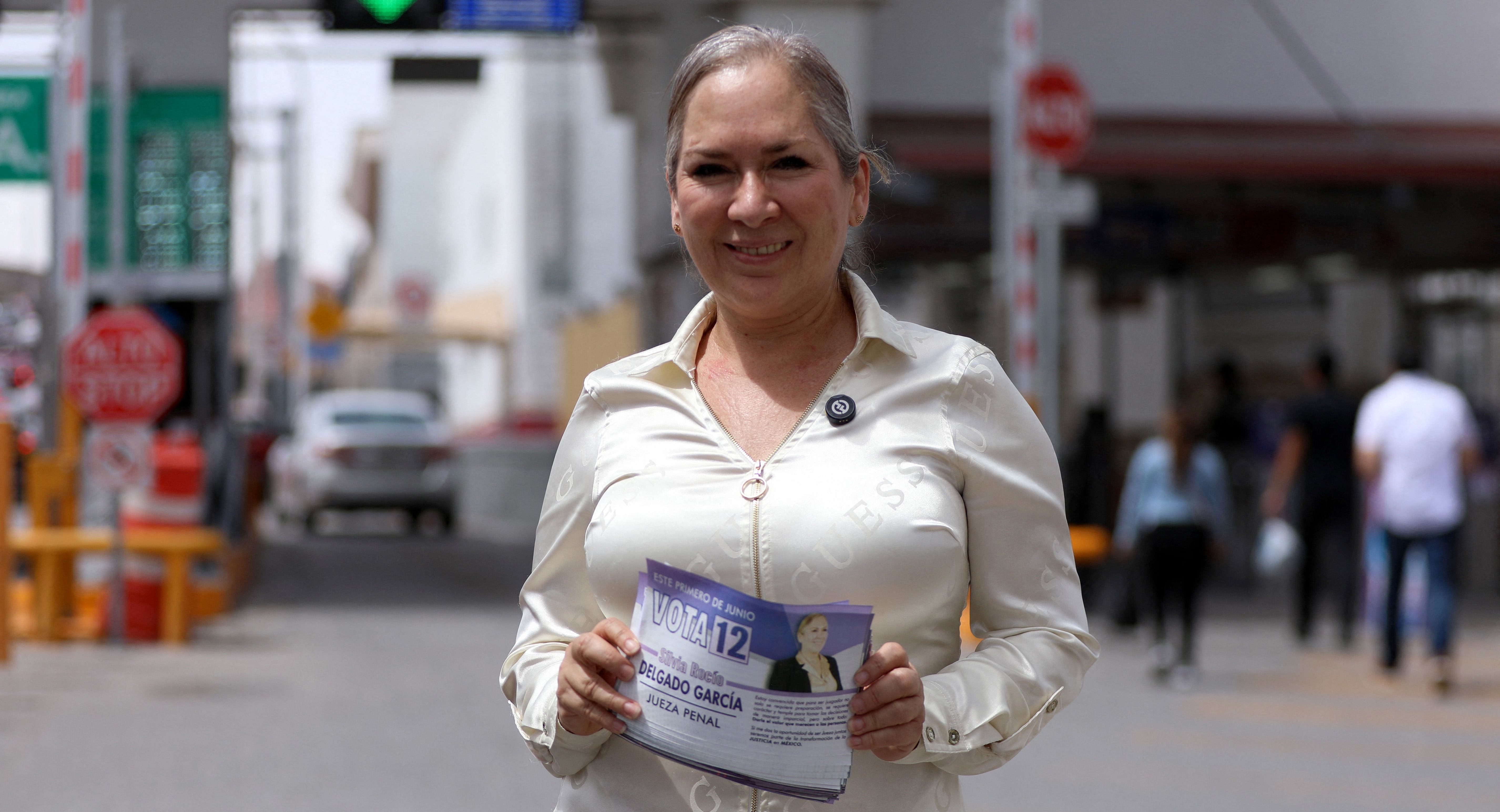Silvia Rocio Delgado Garcia, candidate for criminal judge for the state of Chihuahua, poses for a picture at the Paso del Norte international bridge in Ciudad Juarez, Chihuahua State, Mexico on May 17, 2025. Delgado Garcia was part of the defense of Joaquin Guzman Loera, known as 'El Chapo,' leader of the Sinaloa cartel, while he was held at the Federal Center for Social Readaptation (Cefereso) No. 9 in Ciudad Juarez. (Photo by Herika Martinez / AFP)