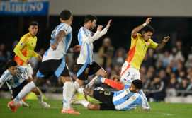 Argentina's forward #10 Lionel Messi (C) and defender #13 Cristian Romero fight for the ball with Colombia's forward #07 Luis Diaz (R) during the 2026 FIFA World Cup South American qualifiers football match between Argentina and Colombia at the Mas Monumental stadium in Buenos Aires, on June 10, 2025. (Photo by Luis ROBAYO / AFP)