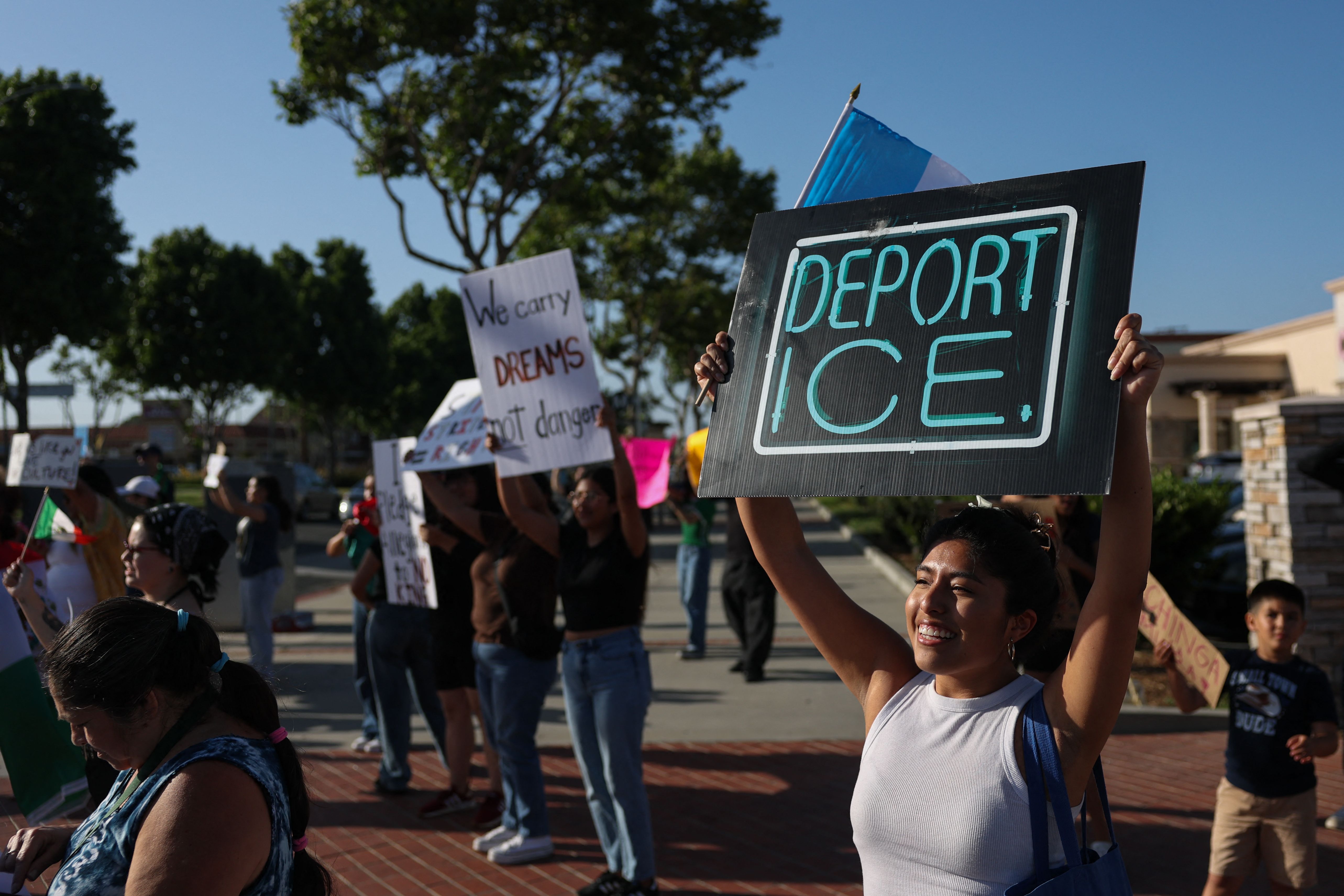 A woman holds a sign reading "Deport ICE" as people peacefully protest following social reports of federal immigration operations by Immigration and Customs Enforcement (ICE) in Lawndale, California on June 18, 2025. Calm appeared to be returning to protest-hit Los Angeles on June 17 as the mayor lifted a nighttime curfew, while US President Donald Trump battled to keep control of California troops he deployed to the city. Roughly half of the stores have begun taking down the plywood that had been put up to protect their windows.
A fraction of the sprawling US city had been off-limits from 8pm to 6am to most people for a week after instances of looting and vandalism during demonstrations against Trump's immigration raids. (Photo by Patrick T. Fallon / AFP)