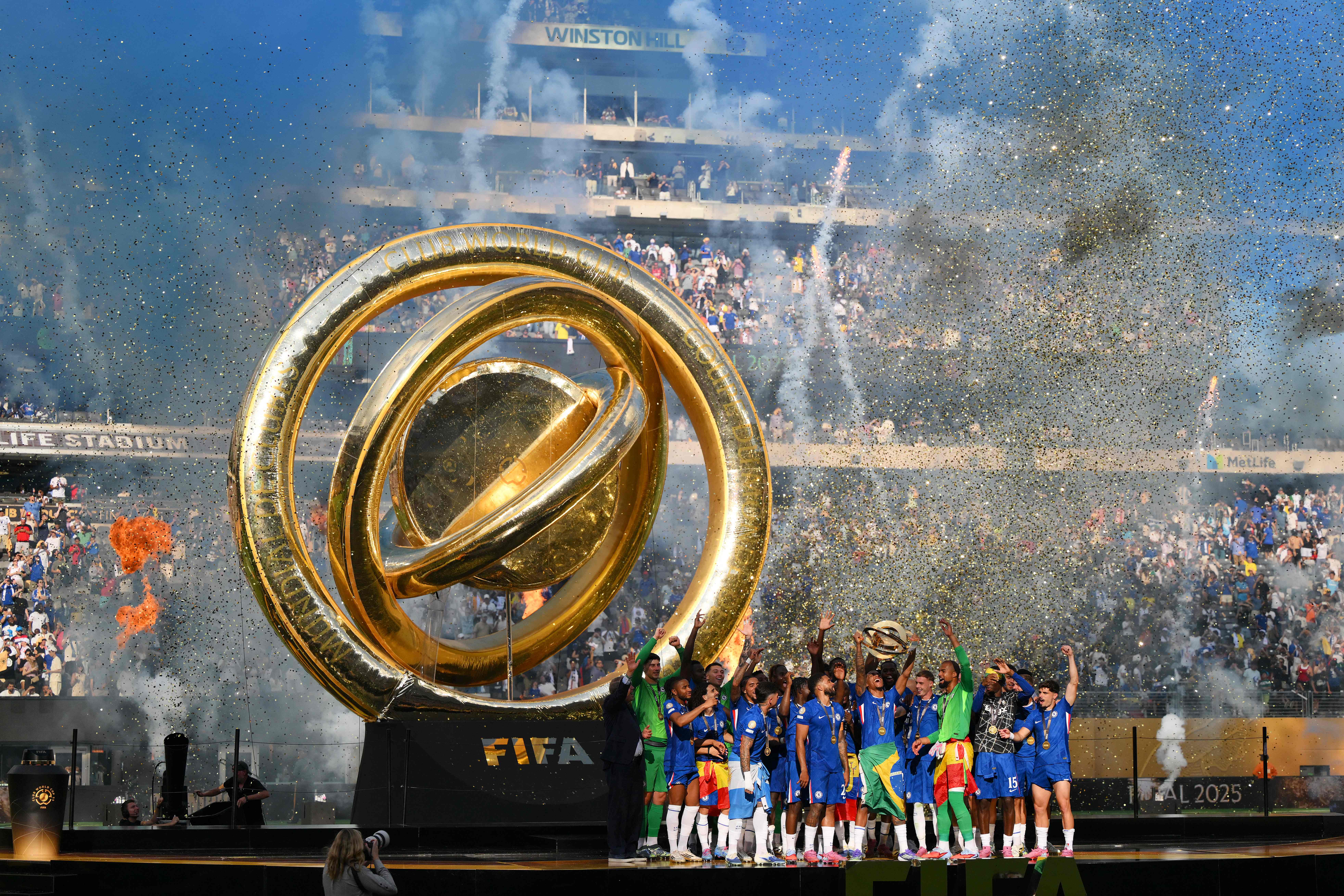 EAST RUTHERFORD, NEW JERSEY - JULY 13: Joao Pedro #20 of Chelsea FC lifts FIFA Club World Cup trophy after their team's victory following the FIFA Club World Cup 2025 Final match between Chelsea FC and Paris Saint-Germain at MetLife Stadium on July 13, 2025 in East Rutherford, New Jersey.   David Ramos/Getty Images/AFP (Photo by David Ramos / GETTY IMAGES NORTH AMERICA / Getty Images via AFP)