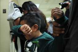 NEW YORK, NEW YORK - AUGUST 26: A child cries after his father is detained by federal agents as they left a court hearing in immigration court at the Jacob K. Javitz Federal Building on August 26, 2025 in New York City. Attorney General Letitia James announced that her office has made a legal filing asking the U.S District Court for the Southern District of New York to block Immigration and Customs Enforcement (ICE) from detaining immigrants inside of courthouses as they attend their court hearings at immigration court.   Michael M. Santiago/Getty Images/AFP (Photo by Michael M. Santiago / GETTY IMAGES NORTH AMERICA / Getty Images via AFP)