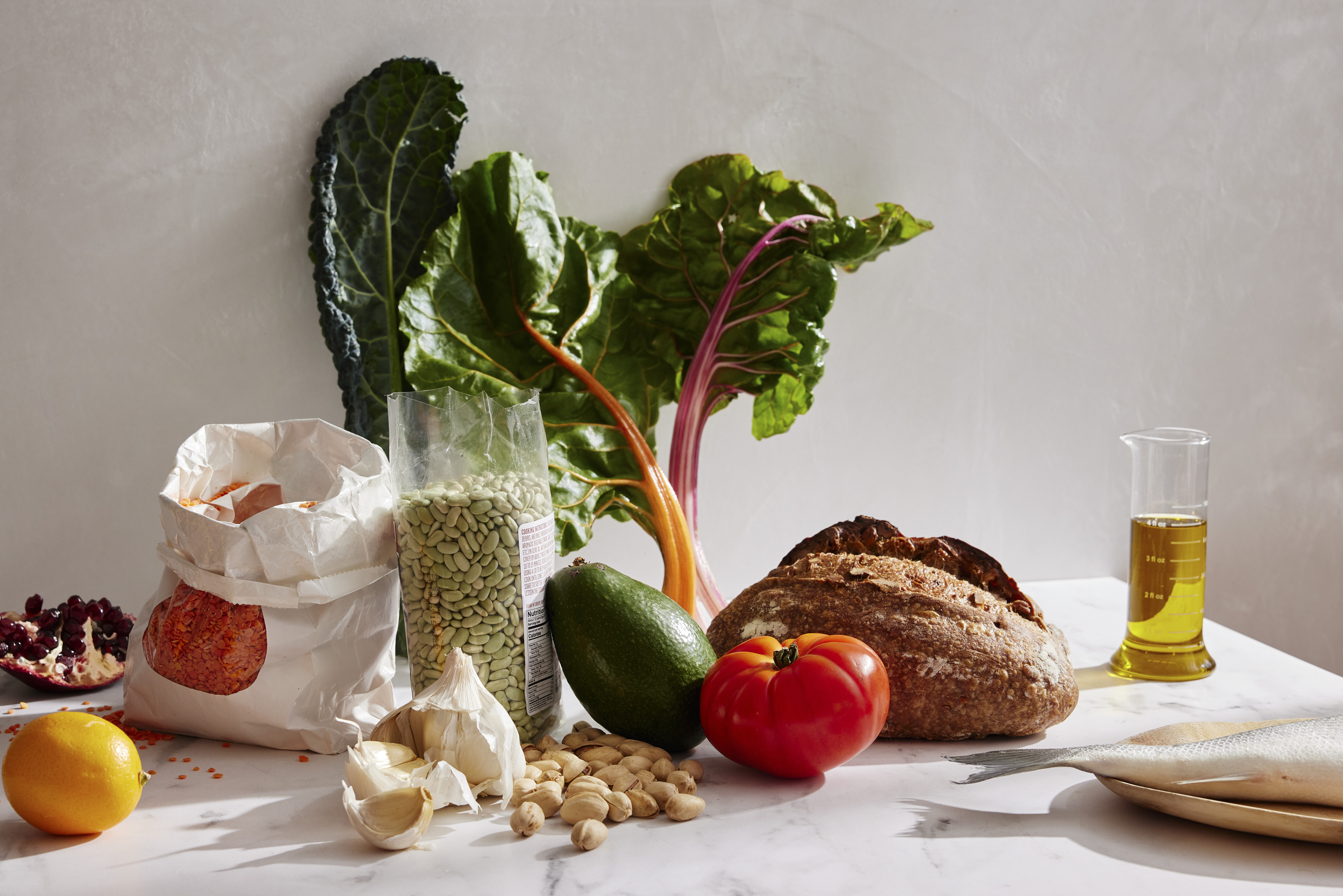 FILE — A variety of foods including tomato, pistachios, avocado, fish, bread and oil. Strong evidence suggests that following the Mediterranean diet, cutting calories and exercising lowers the chances of developing diabetes for those with metabolic risk factors. (Bobbi Lin/The New York Times)