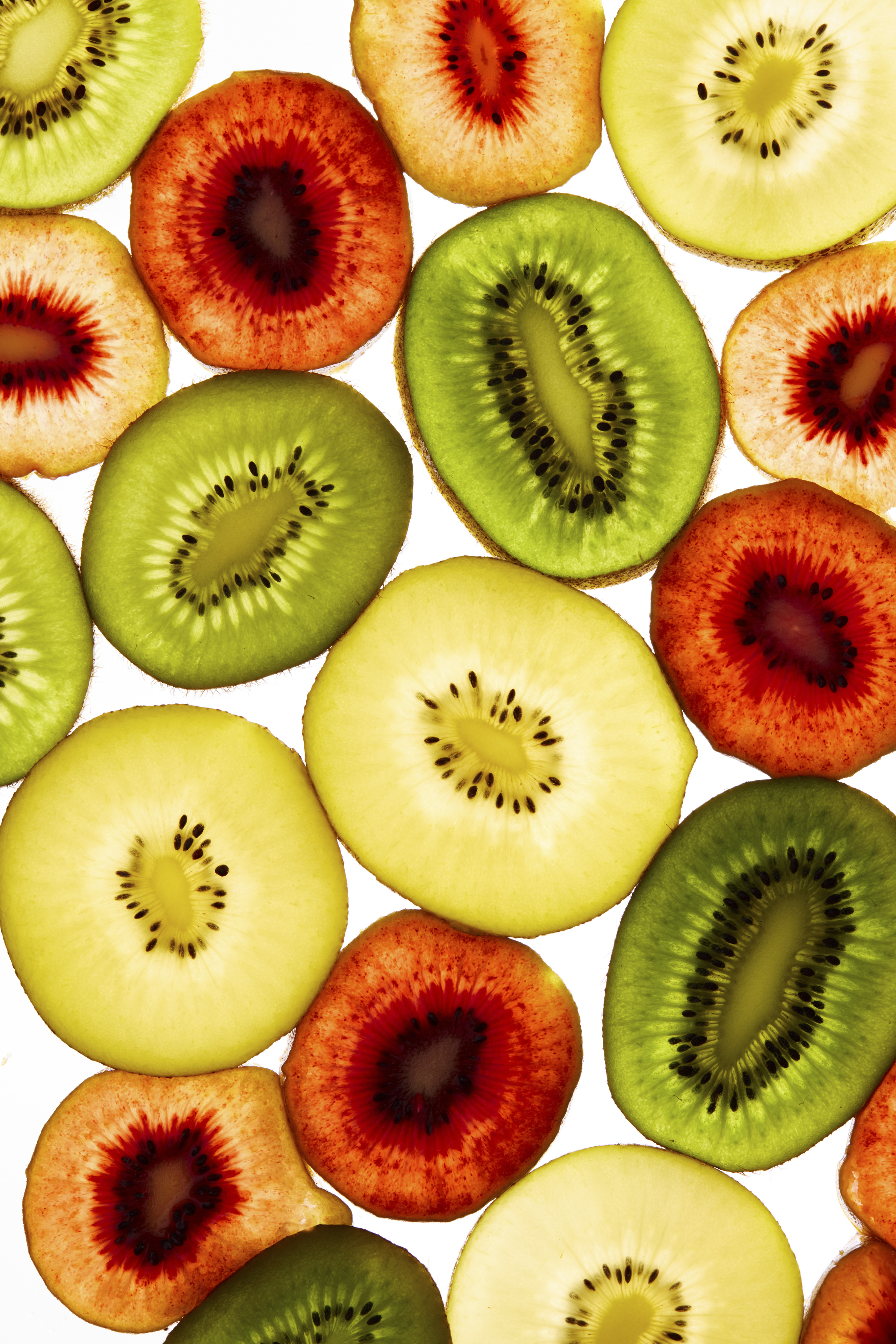 An illustrative image with slices from a variety of kiwi fruits, Aug. 7, 2025. These brown, fuzzy fruits with green, yellow or even red flesh are packed with beneficial nutrients,  vitamin C and also fiber, which slows digestion also binds to “bad” cholesterol, or LDL, in the intestine, helping to remove it from your body. (Bobbi Lin/The New York Times)