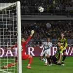 Real Madrid's French forward #10 Kylian Mbappe (2nd L) reacts in front of Kairat Almaty's Kazakh goalkeeper #82 Sherhan Kalmurza during the UEFA Champions League first round day 2 football match between Kairat Almaty and Real Madrid at the Almaty Ortalyk stadion in Almaty on September 30, 2025. (Photo by Vyacheslav OSELEDKO / AFP)
