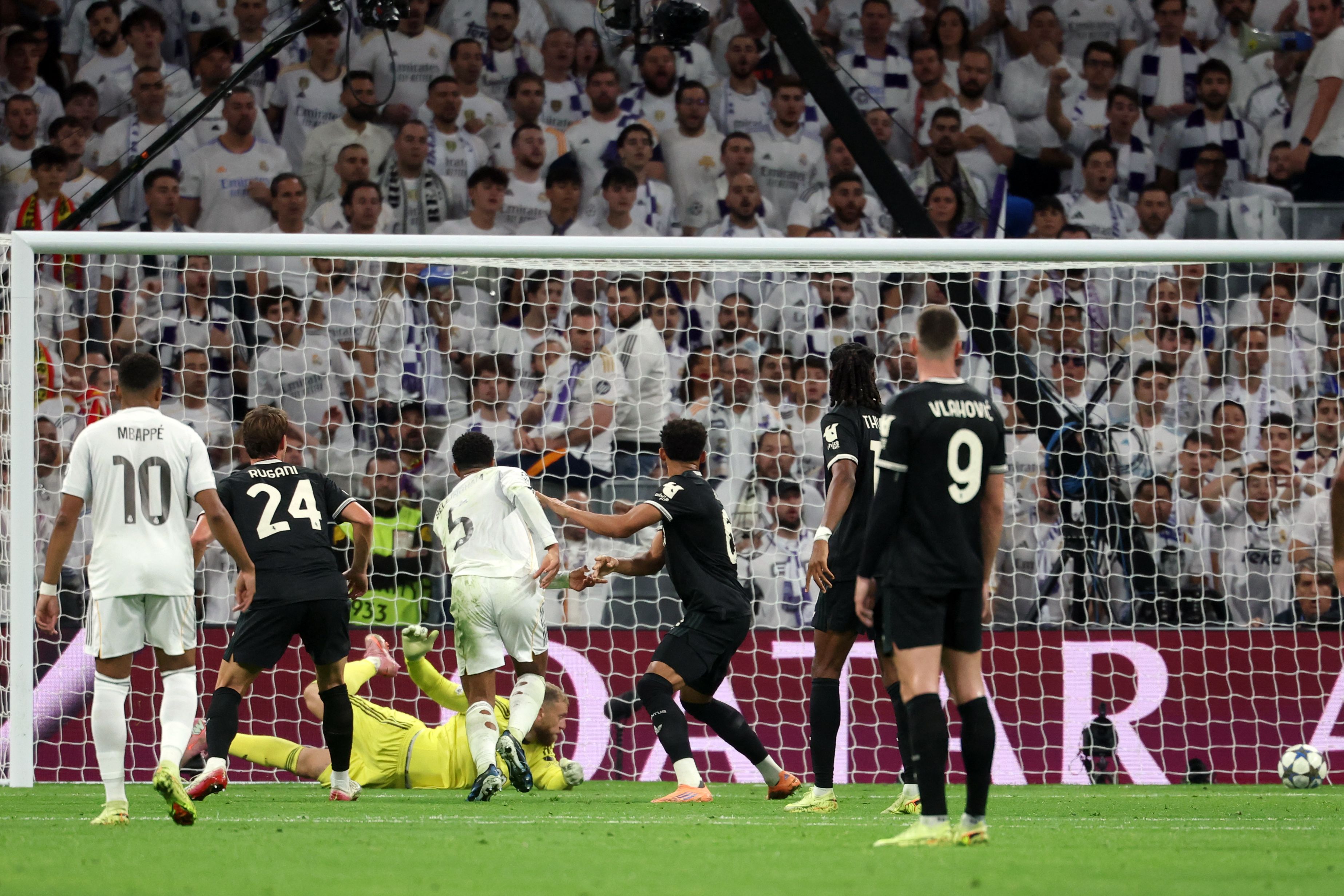 Real Madrid's English midfielder #05 Jude Bellingham (4L) scores the opening goal during the UEFA Champions League league phase day 3 football match between Real Madrid CF and Juventus at Santiago Bernabeu Stadium in Madrid on October 22, 2025. (Photo by Pierre-Philippe MARCOU / AFP)
