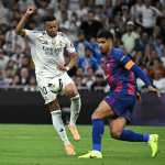 Barcelona's Uruguayan defender #04 Ronald Federico Araujo da Silva (R) vies for the ball with Real Madrid's French forward #10 Kylian Mbappe during the Spanish league football match between Real Madrid CF and FC Barcelona at the Santiago Bernabeu stadium in Madrid on October 26, 2025. (Photo by JAVIER SORIANO / AFP)