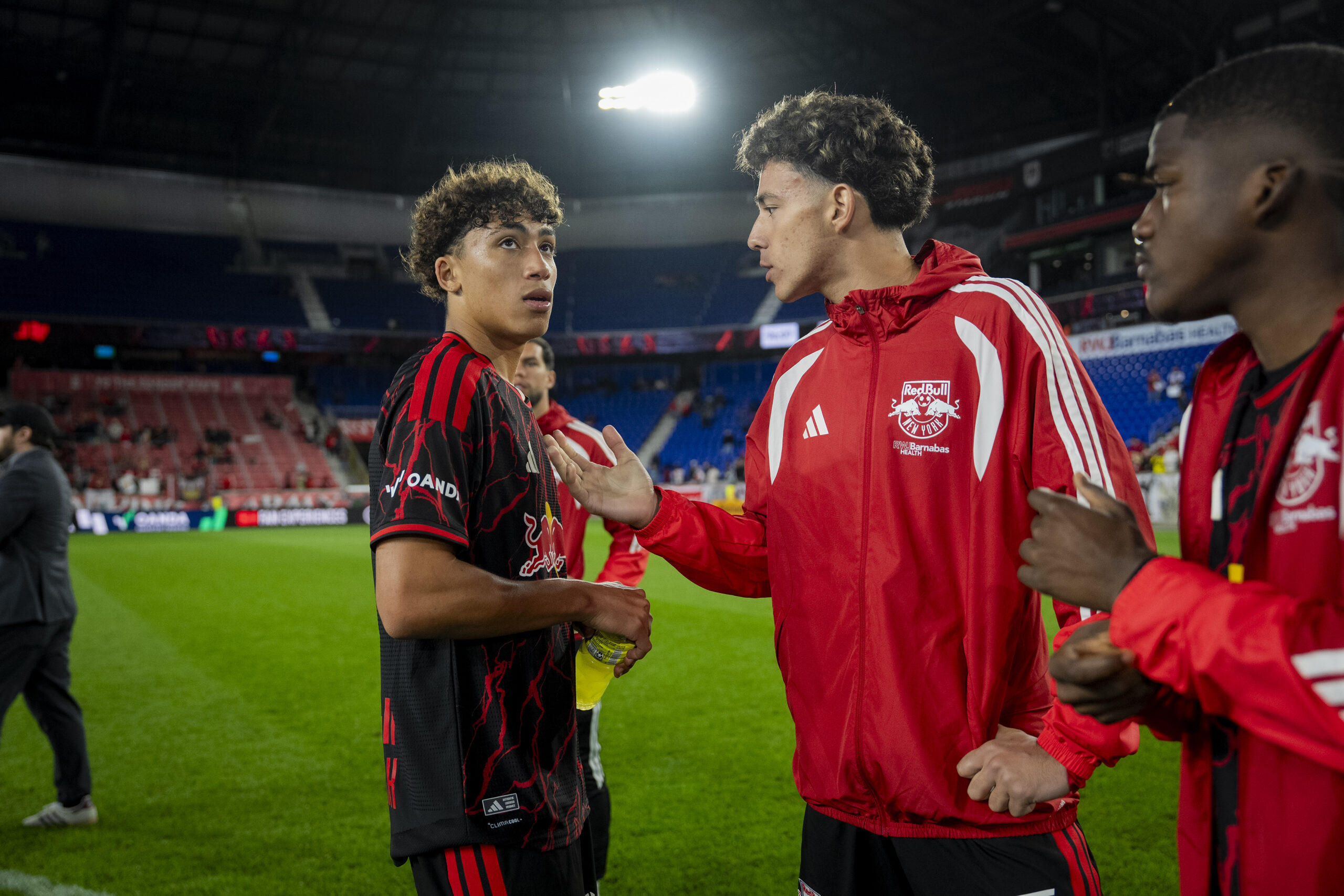 Adri Mehmeti, right, and Julian Hall, of the New York Red Bulls, speak after a game against D.C. United at Sports Illustrated Stadium in Harrison, N.J., April 23, 2026. The goal for most promising young American players is to play for a European club. (Vincent Alban/The New York Times)