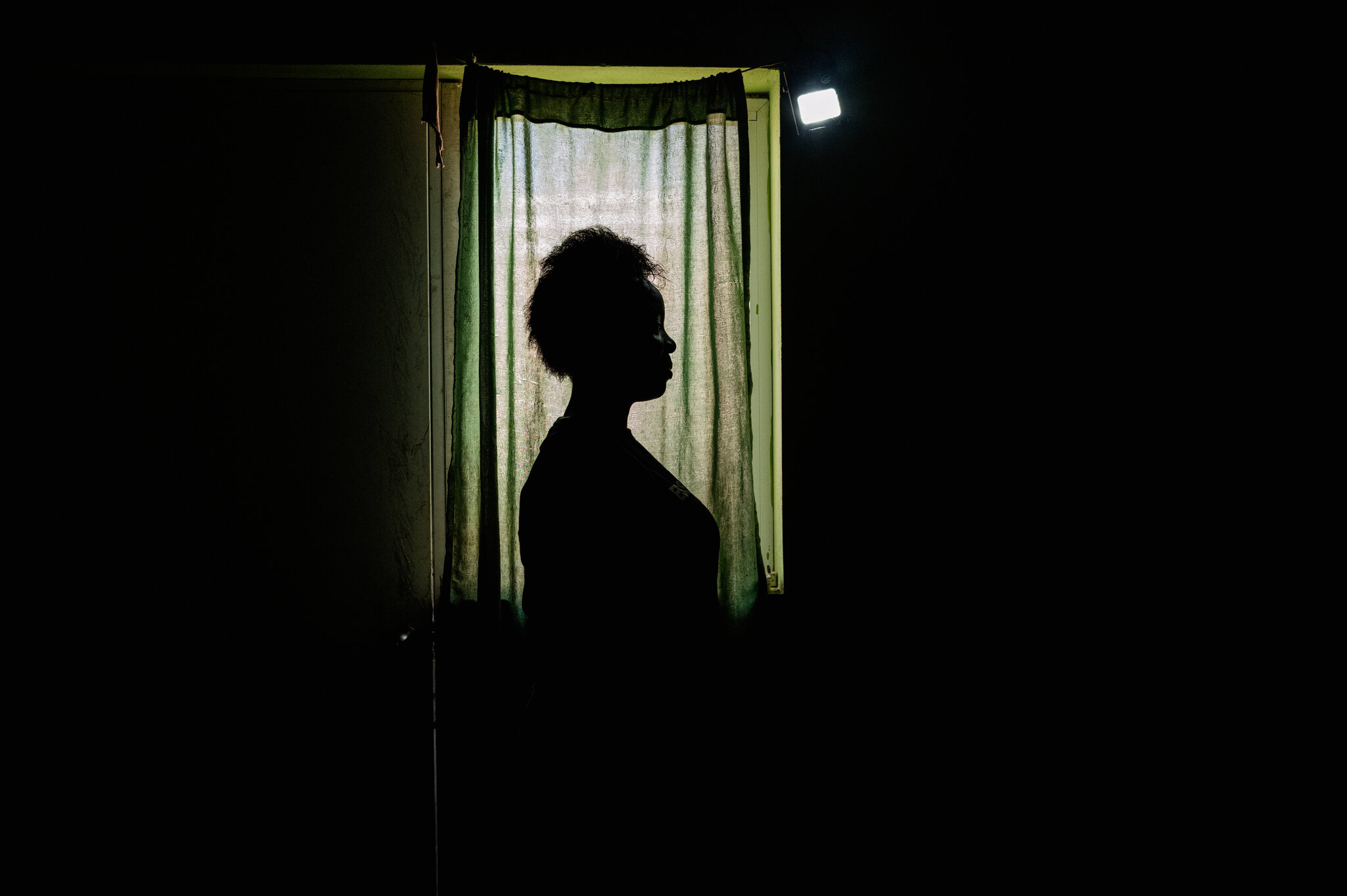 Katty Joseph, 20, in the room where she gave birth in the Dominican Republic. She said she delivered on the floor of her home because she feared that seeking care in a public hospital without legal documents could lead to detention or deportation. Ana María Arevalo Gosen for The New York Times