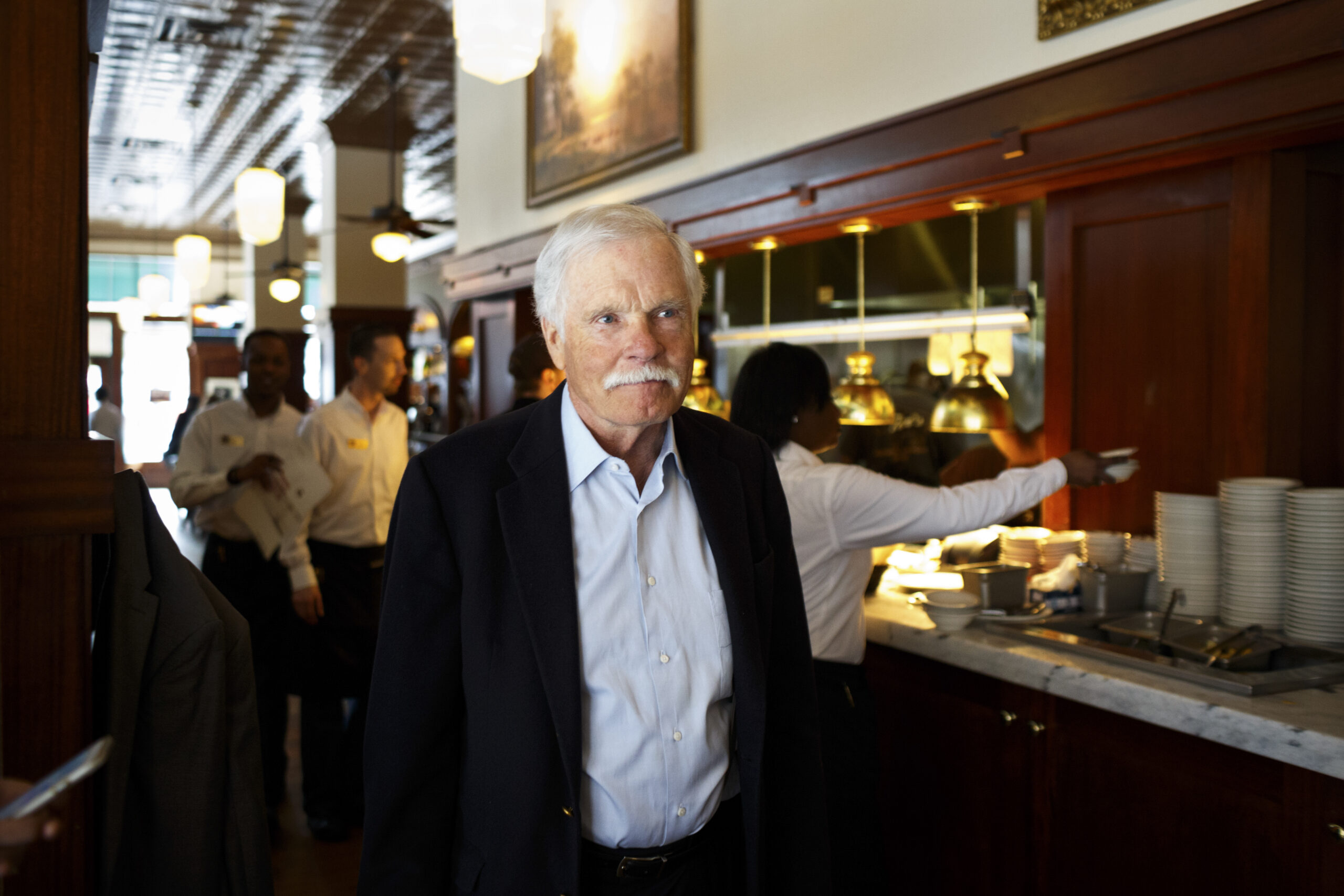 FILE — Ted Turner at a location of Ted’s Montana Grill, his chain of restaurants that serve bison, in Atlanta, Jan. 27, 2016. Turner, the media mogul who cut a brash and vivid figure on the American scene of the late 20th century by dominating the cable television industry, creating the 24-hour news cycle with CNN, and extending his restless reach into professional sports, environmentalism and philanthropy, died on Wednesday, May 6, 2026, at his home near Tallahassee, Fla. He was 87. (Dustin Chambers/The New York Times)