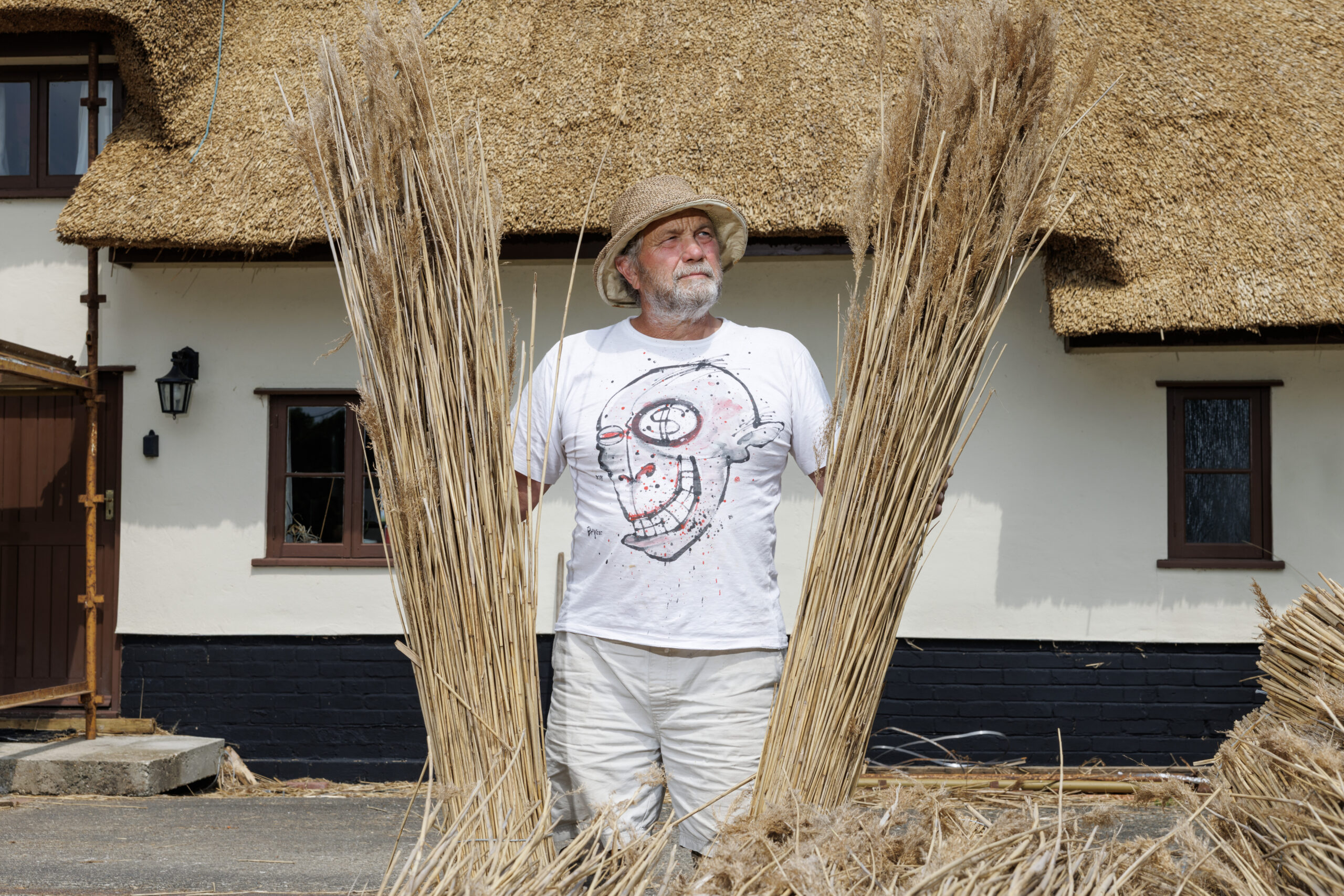 NYTSELECTS -- A thatched roof renovated with water reeds, which can have nearly twice the life of long-straw thatch, in East Horsley, England, May 26, 2026. Inside the tiny community of English master thatchers, a fight is unfolding over a tradition that may not survive. (Jeremie Souteyrat/The New York Times)