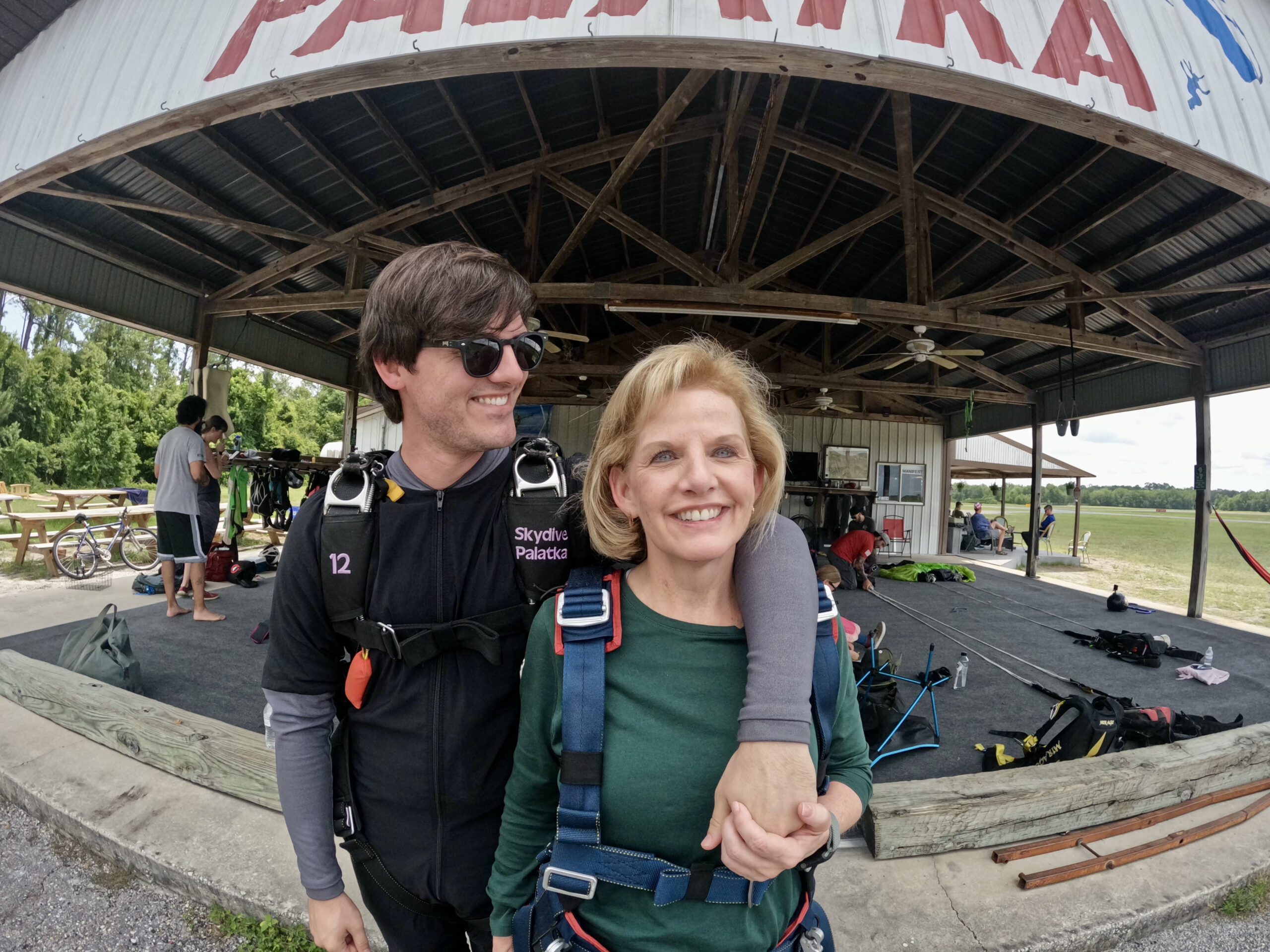 In a family photo, Blake Thacker and his mother, Sherry, in 2025. Thacker, 25, a software engineer at Garmin who had recently interned at NASA, was training to become a certified skydiving coach when he died in the Missouri plane crash in June 2026. (Sherry Thacker via The New York Times) -- NO SALES; FOR EDITORIAL USE ONLY WITH NYT STORY EXTREME SPORTS MOTIVATION by STREETER and BOGEL-BURROUGHS of JUNE 18, 2026. ALL OTHER USE PROHIBITED --