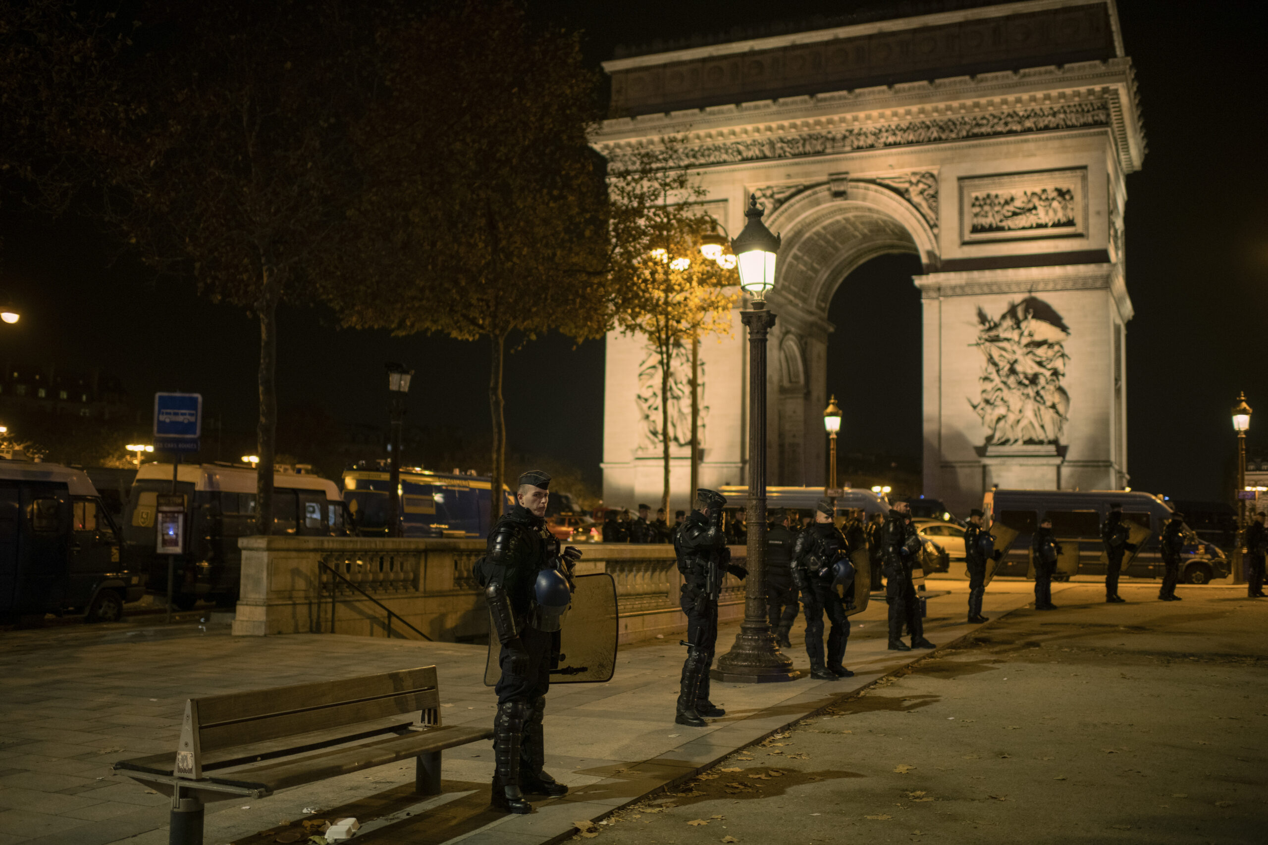 FILE -- French law enforcement officers deployed in Paris after France's victory against Morocco in the 2022 World Cup, Dec. 14, 2022. When France plays Morocco on Thursday, July 9, 2026 in Boston, it will be the next chapter in what has become a dramatic subplot of these World Cup tournaments: a postcolonial clash, laden with history, symbolism and a dash of score settling. (Dmitry Kostyukov/The New York Times)