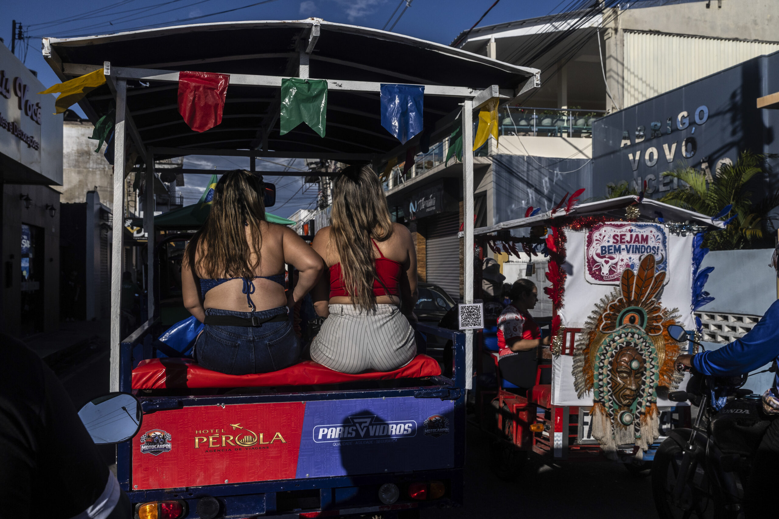 The arena in Parintins, Brazil, showing both red and blue bulls on the facade before hosting a series of performances to determine the annual winning bull, on June 27, 2026. Deep in the Amazon rainforest, a heated rivalry has split a town for a century. It's got nothing to do with sports or politics, though. (Dado Galdieri/The New York Times)