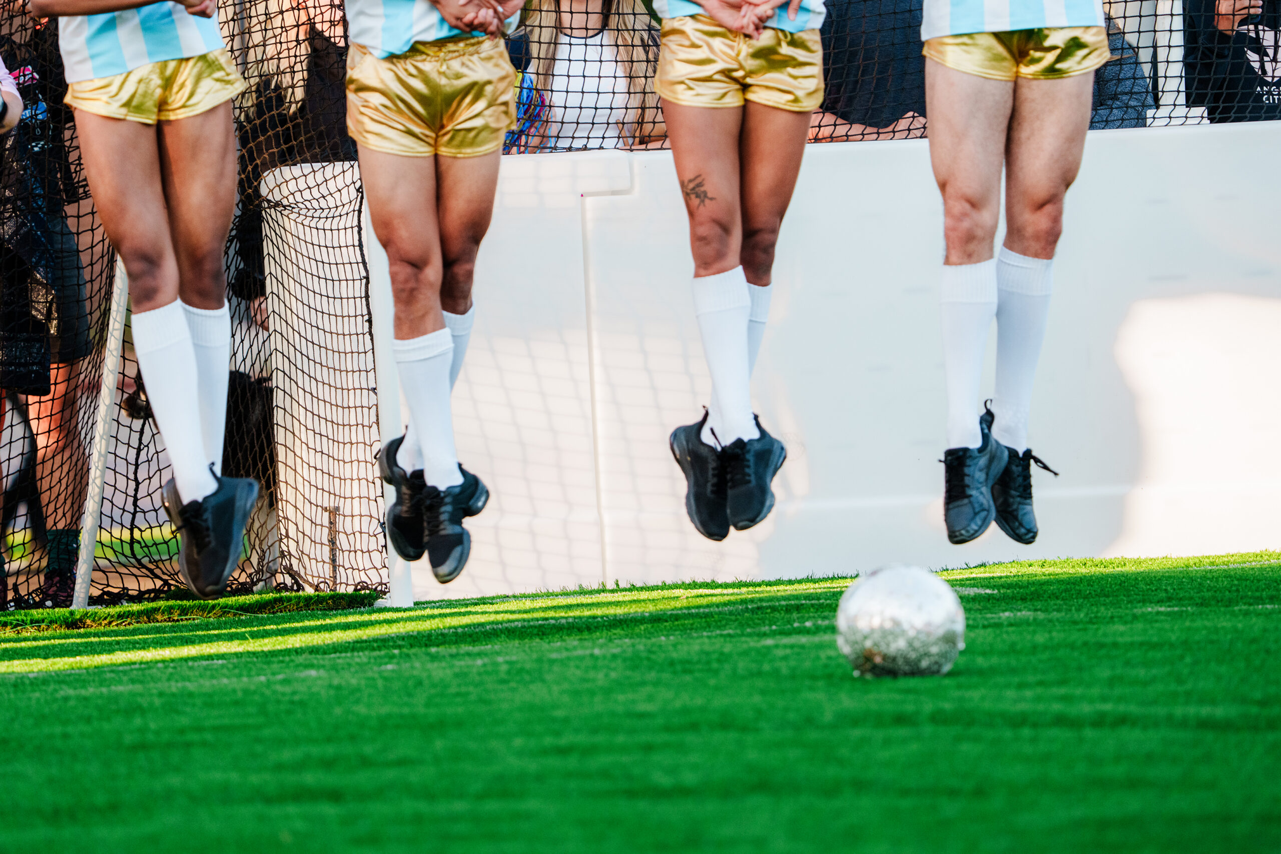 NYTSELECTS - Players during "Discofoot," at West Hollywood Park in Los Angeles on June 26, 2026. The premise of "Discofoot" is simple: Get the ball across the field to score a goal. But instead of running or dribbling, you have to dance. (Gabriela Bhaskar/The New York Times)
